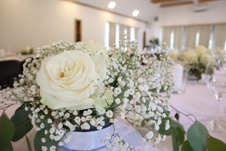 Table decorated with white roses